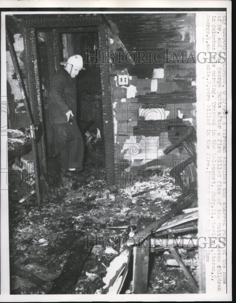 1957 Press Photo Firemen examine the charred ruin of the home in Columbus. - Historic Images