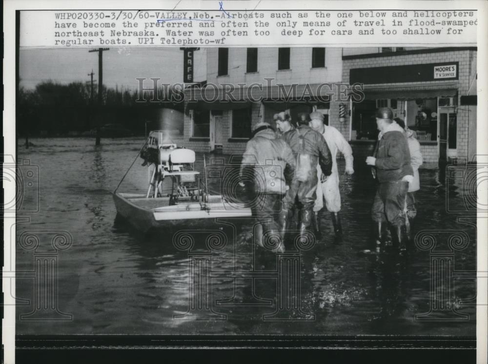 1960 Press Photo of an air boat in Valley Nebraska after flooding occurred. - Historic Images