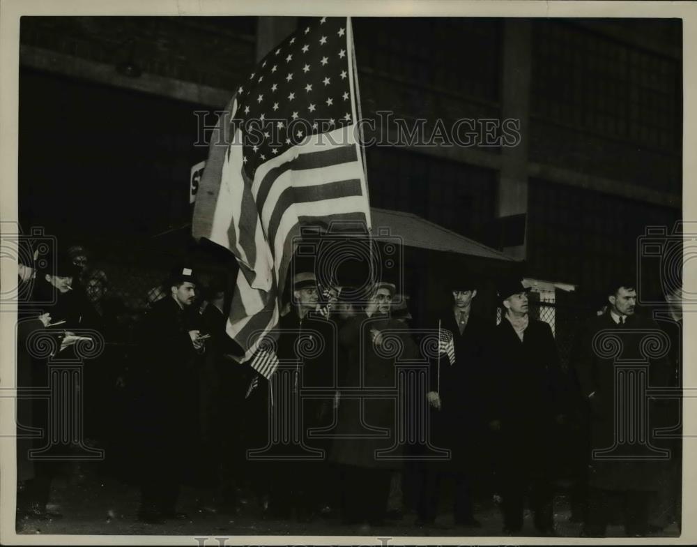 1937 Press Photo Men coming out of Fisher Olant carrying their country&#39;s flag. - Historic Images