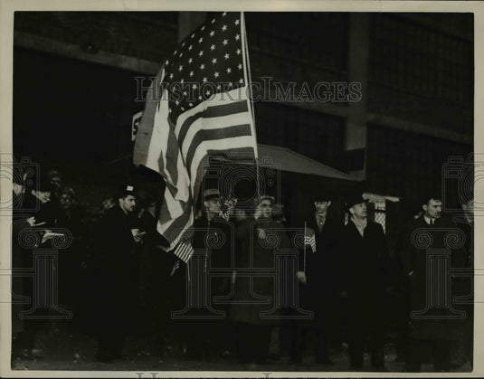 1937 Press Photo Men coming out of Fisher Olant carrying their country's flag. - Historic Images