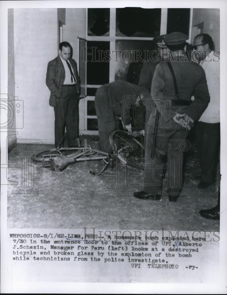 1962 Press Photo Alberto Schazin at bomb explosion wreckage in Lima, Peru - Historic Images