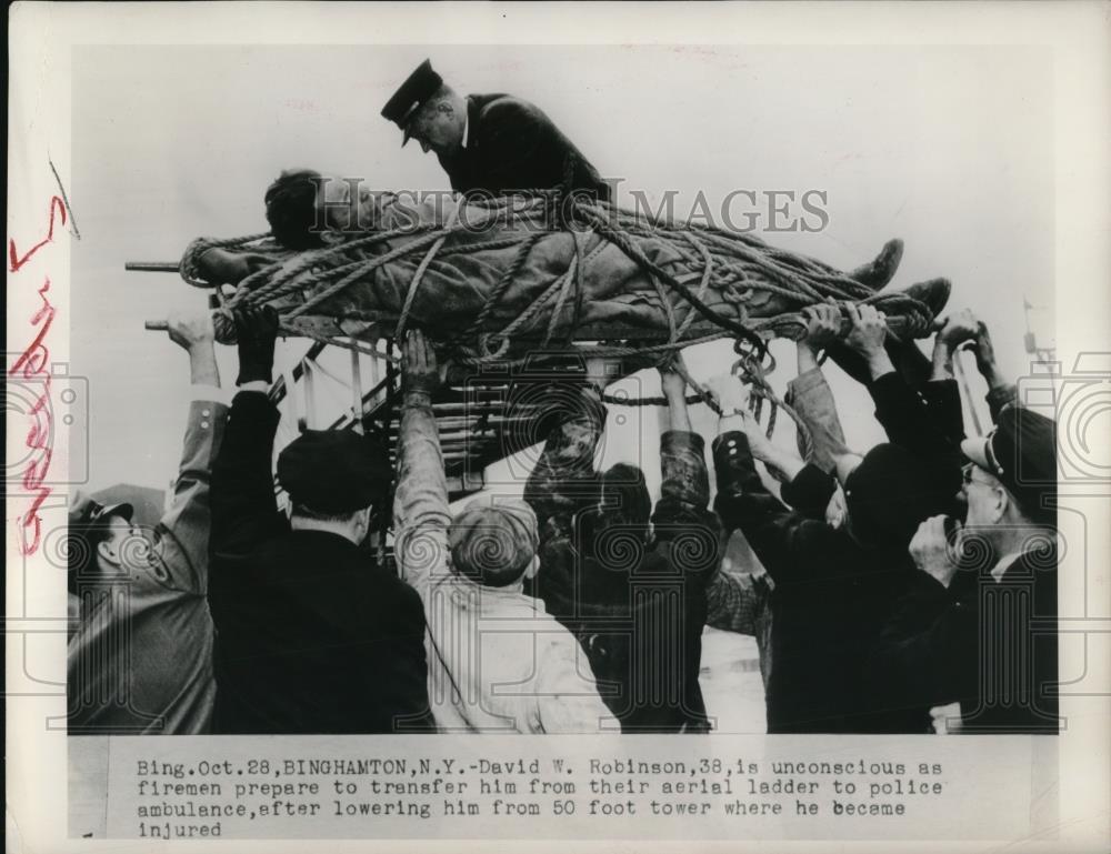 1948 Press Photo Firemen preparing David Robinson for a transfer - Historic Images