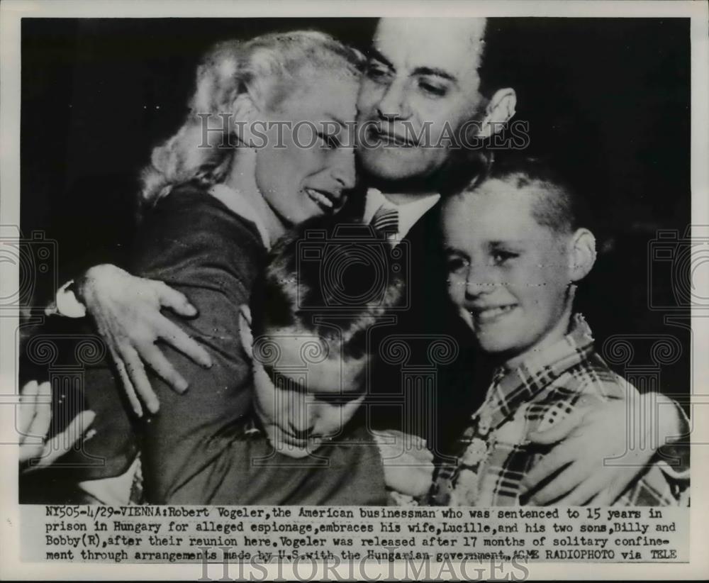 1951 Press Photo of Robert A Vogler being embraced by his family after his - Historic Images