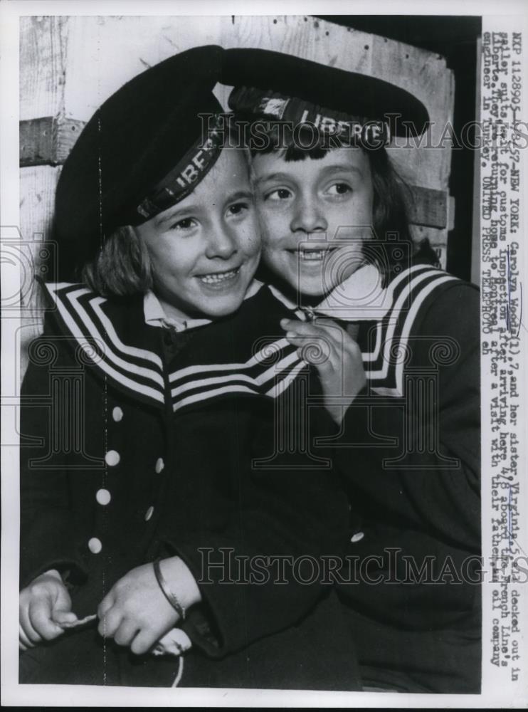 1957 Press Photo Wood sisters on their sailr suits for custom inspection - Historic Images