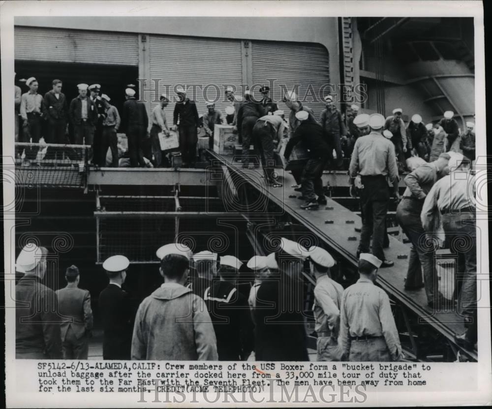 1950 Press Photo of crew members of the USS Boxer form a bucket brigade to - Historic Images