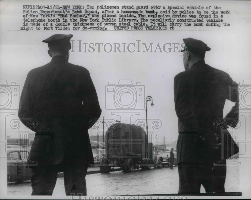 1956 Press Photo Policemen stand guard for a speicial vehicle. - Historic Images