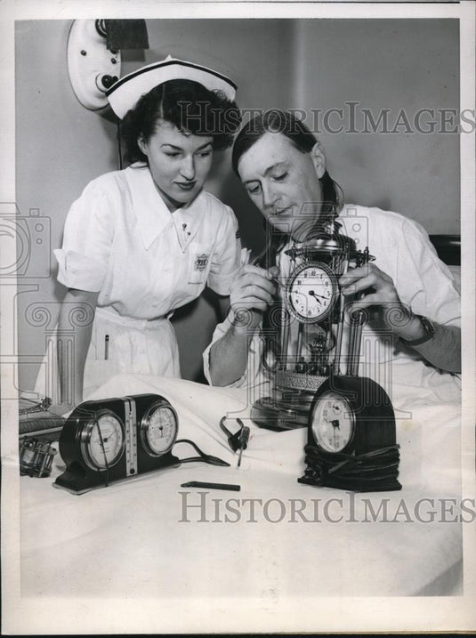 1945 Press Photo Oak Park Ill Walter Williams, nurse Ramona Chandler & clocks - Historic Images