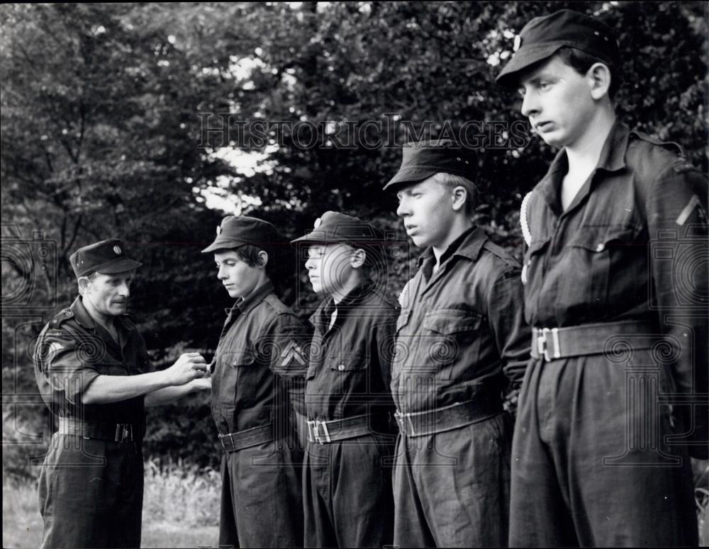 Press Photo The major inspects his army's uniforms - Historic Images