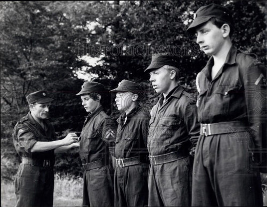 Press Photo The major inspects his army's uniforms - Historic Images