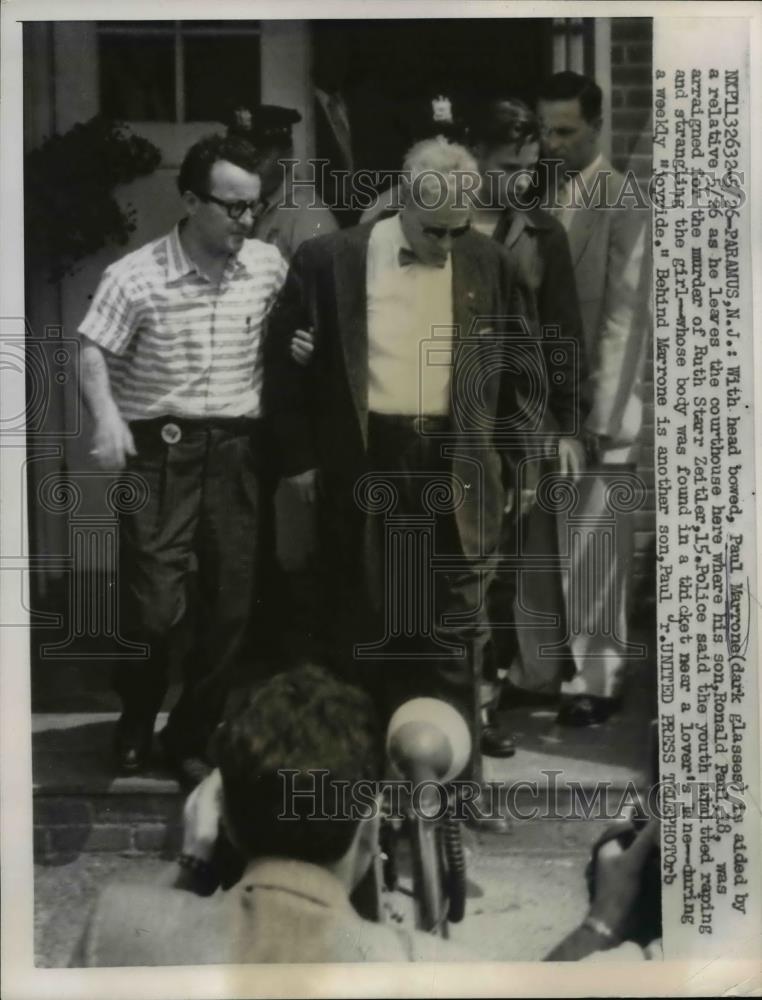 1957 Press Photo Paramus NJ Paul Margone aided by relative as he leaves court - Historic Images