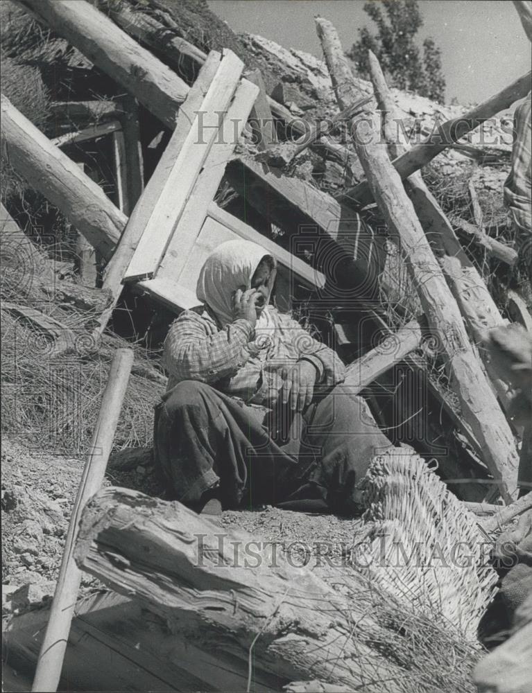 1971 Press Photo Survivor sits amid earthquake rubble in Turkey - Historic Images