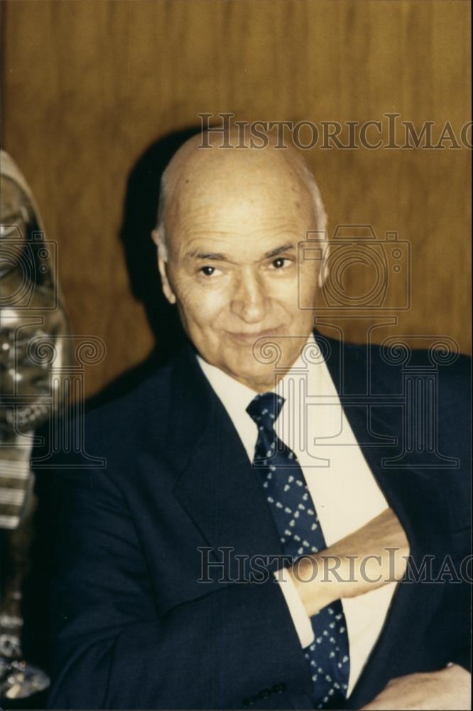 Press Photo Man Reaching Into Jacket Pocket - Historic Images