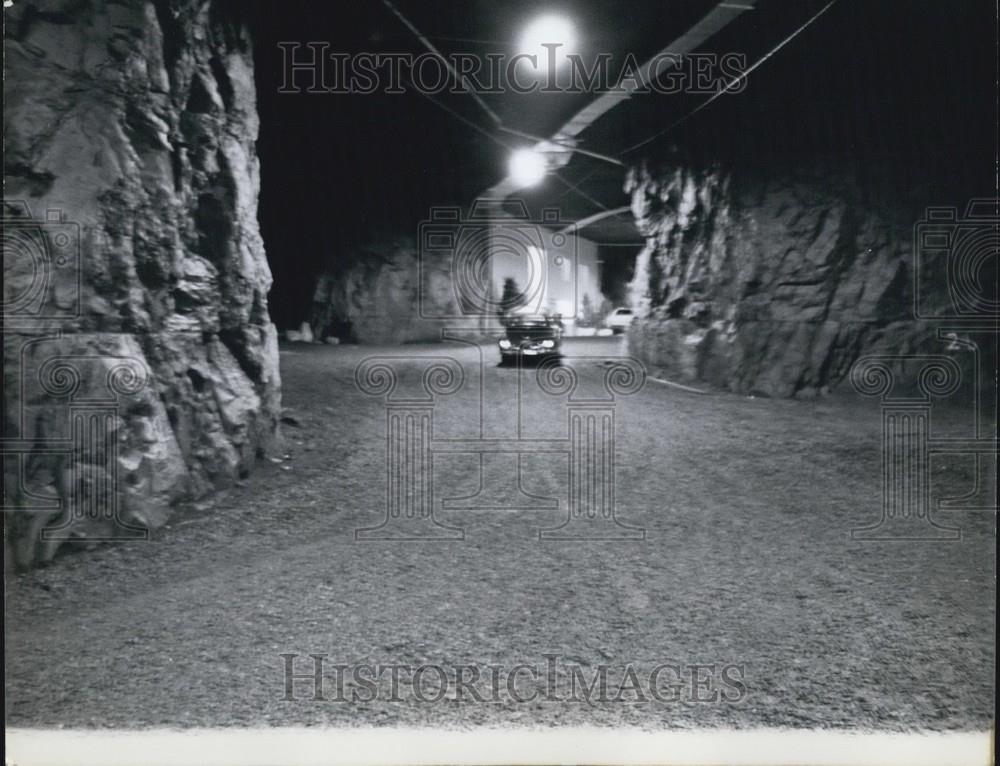 Press Photo Someone Travels On The Road Outside Cave-Like Home - Historic Images