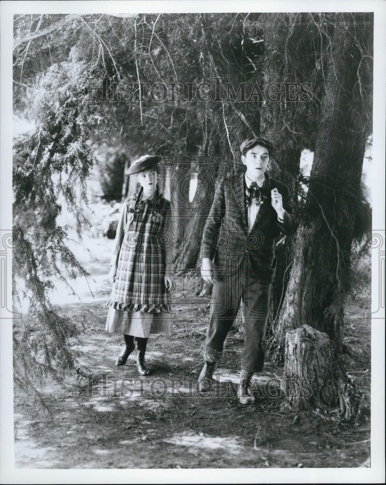 Press Photo Boy and girl Surrounded by trees - Historic Images