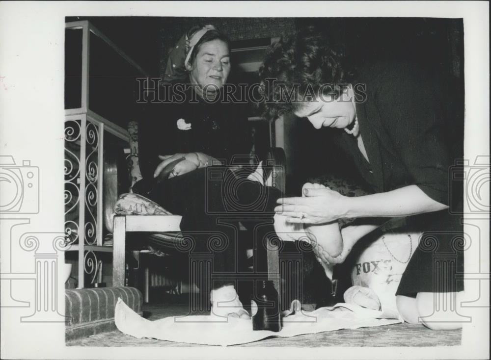 Press Photo Woman gives another Woman Foot Massage - Historic Images