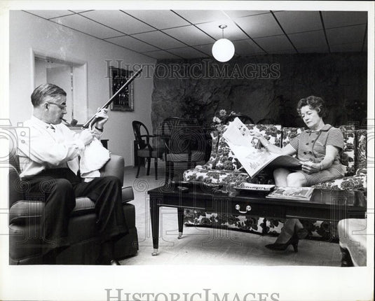 Press Photo Mr. Walker Cleaning His Hunting shotgun - Historic Images