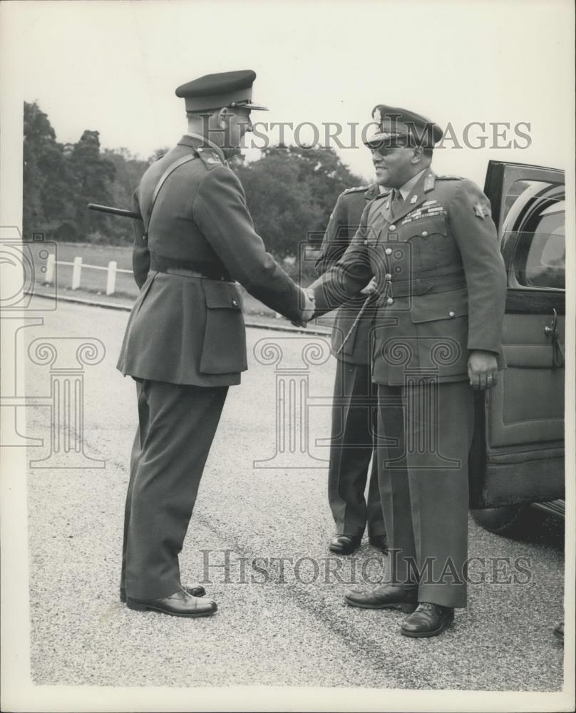 1954 Press Photo General Rana greeted by Major General R.G.S. Hobbs cain. - Historic Images