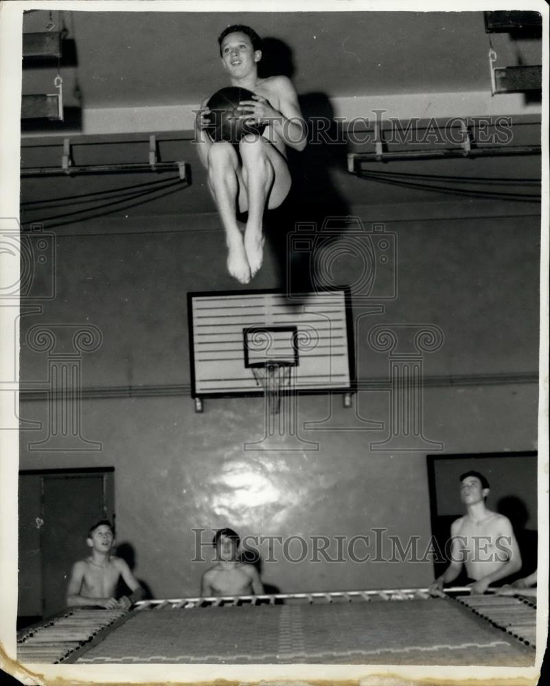 Press Photo Brian Phelps practices diving jumps on trampoline - Historic Images
