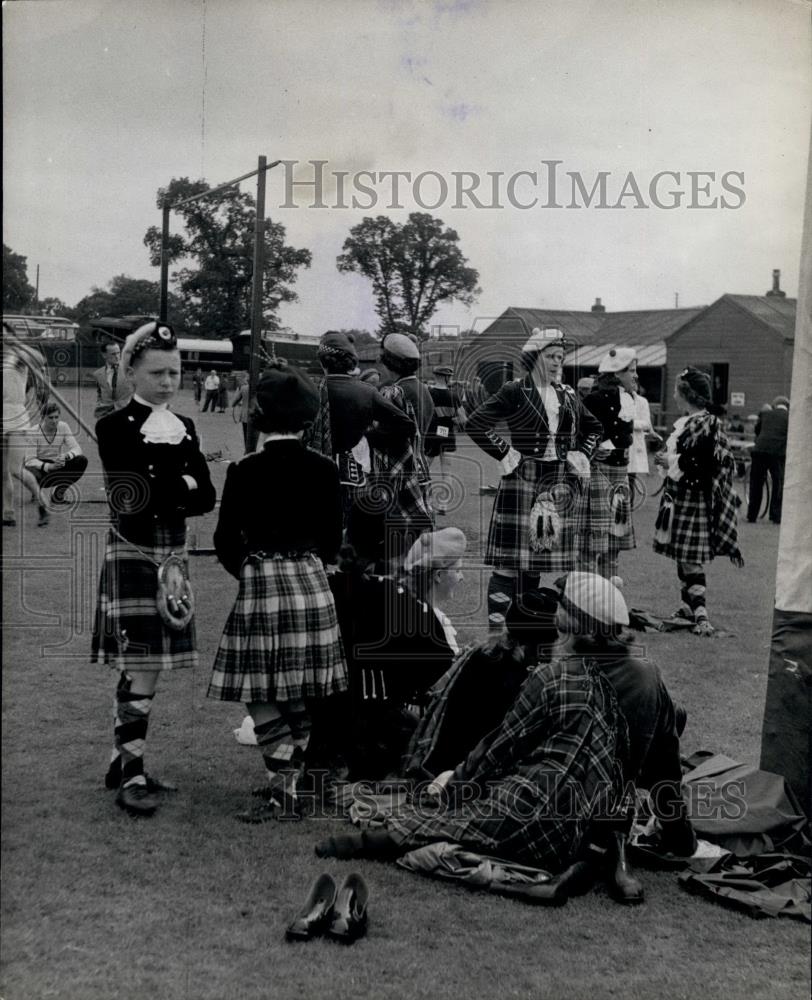 Press Photo Boy and Girl Highland Dancers watching - Historic Images