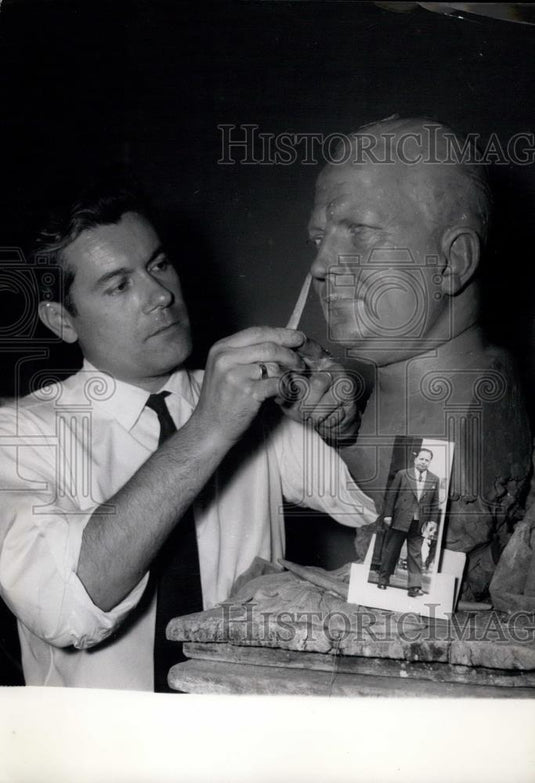 1956 Press Photo M. Barbieri, Grevin's sculptor, with the bust of Lacoste - Historic Images