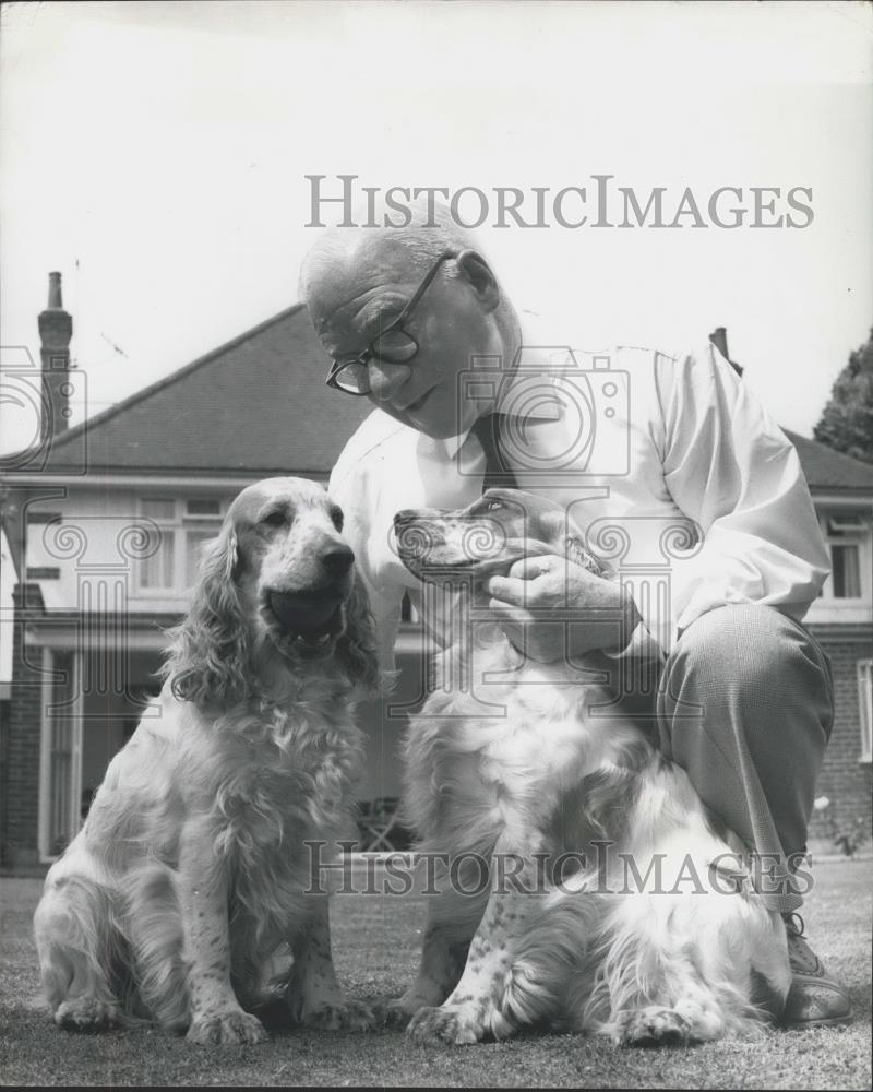 1961 Press Photo Jerry Green with two of his favorite cocker spaniels - Historic Images