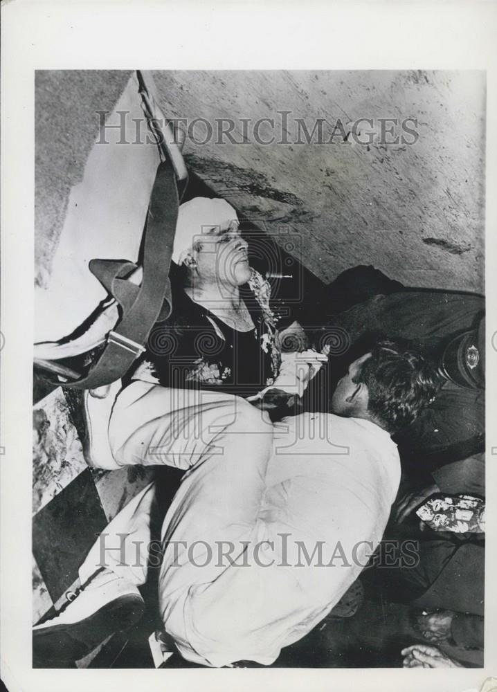 1950 Press Photo Richard Lohr being treated after an attack by bandits. - Historic Images