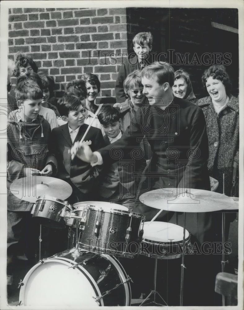 1962 Press Photo Father De Wolf plays drums for children - Historic Images