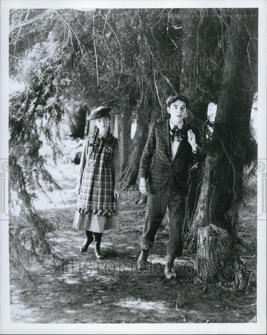 Press Photo boy and girl surrounded by trees - Historic Images