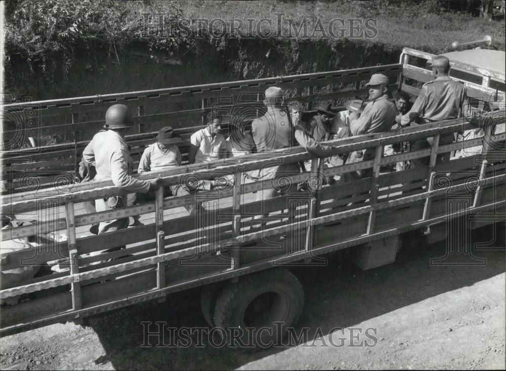 Press Photo Men Being Transported In An Open Flatbed - Historic Images