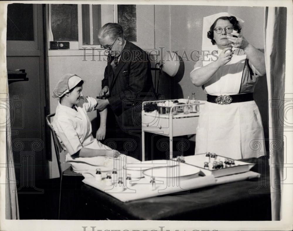 Press Photo Factory Workers getting Flu shots - Historic Images