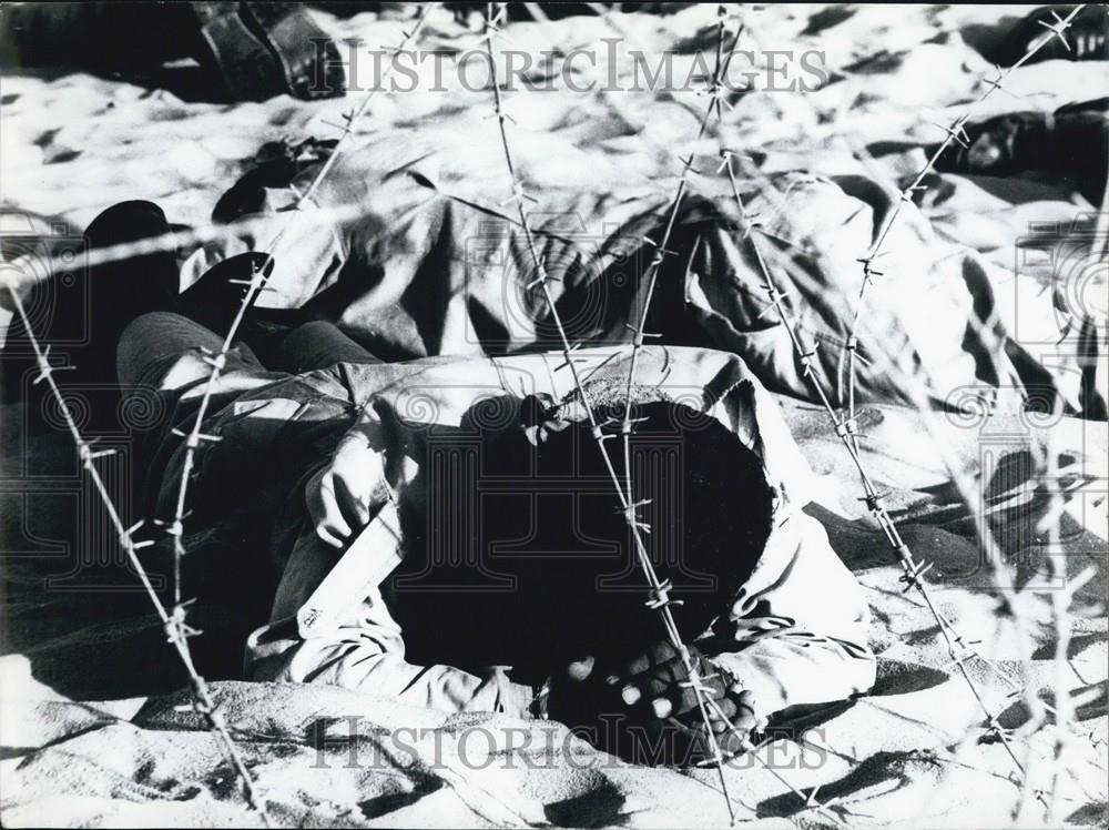 Press Photo A Man sleeping in the sand - Historic Images