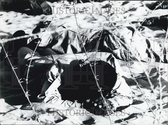 Press Photo A Man sleeping in the sand - Historic Images