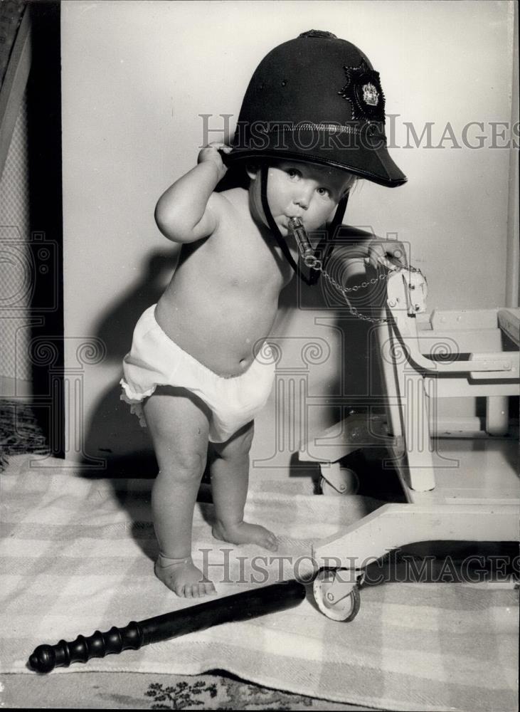 Press Photo Gina Allison Dulie of Ilford, Essex in dads police hat - Historic Images