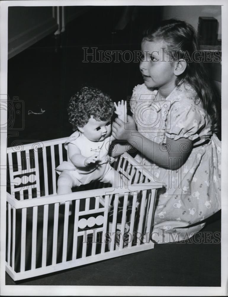 1956 Press Photo of Patrica Brigadier age playing with her doll. - Historic Images