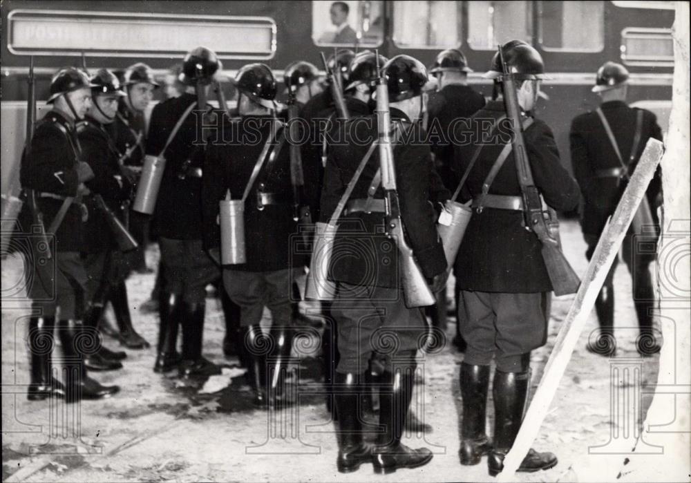 1954 Press Photo Helmeted Gendarmes wearing gas masks at a riot scene - Historic Images