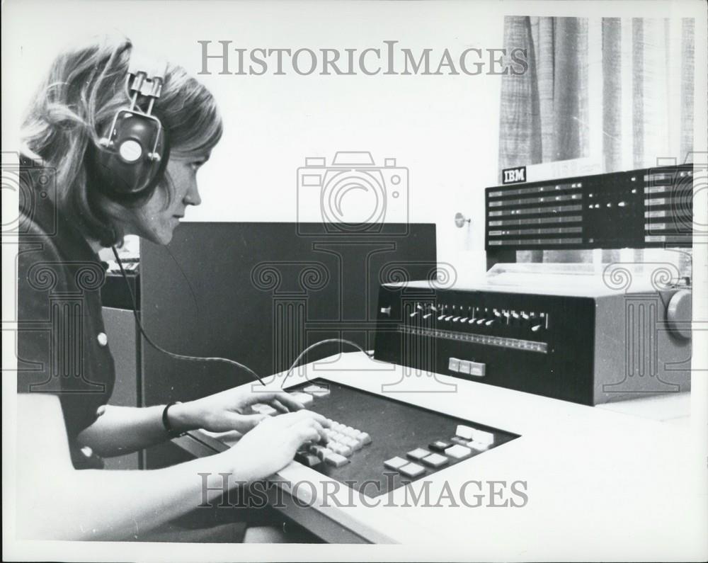 Press Photo Woman Listening to a machine - Historic Images