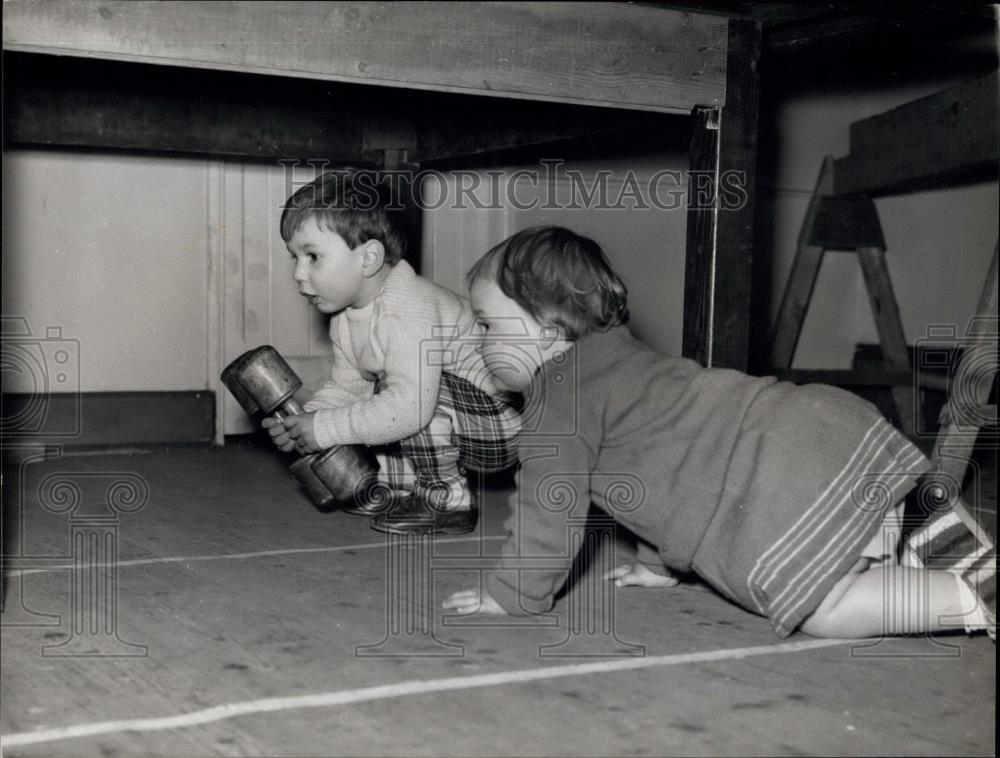 Press Photo Then under the table they must go - Historic Images