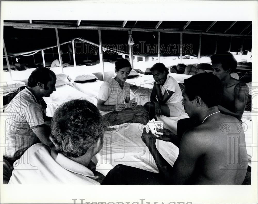 Press Photo Cuban refugees pass the time by playing cards - Historic Images