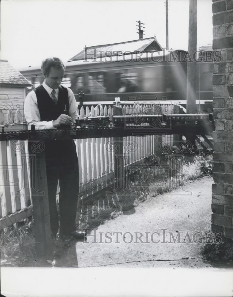 Press Photo Mr. Hutchinson working at the model railway - Historic Images