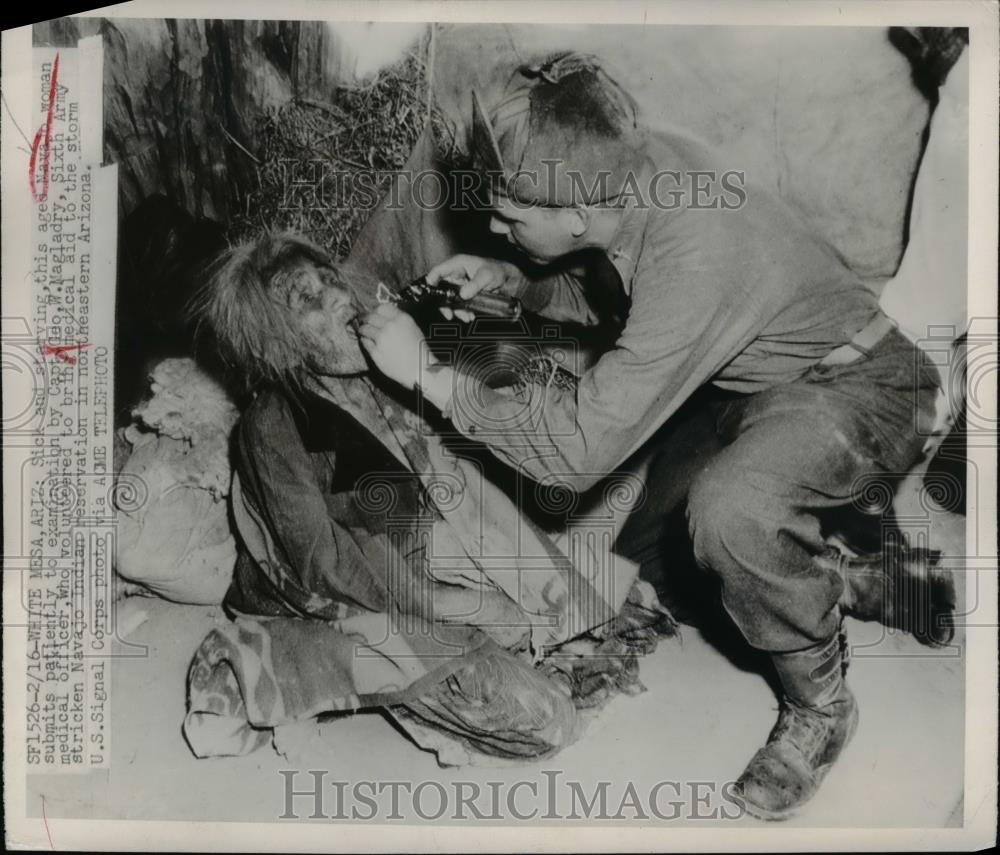 1949 Press Photo Aged Navajo woman examined by Capt Geo W Magladry - Historic Images