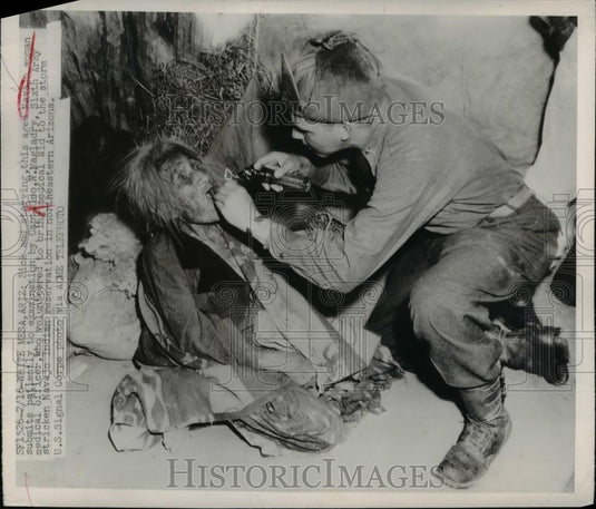 1949 Press Photo Aged Navajo woman examined by Capt Geo W Magladry - Historic Images