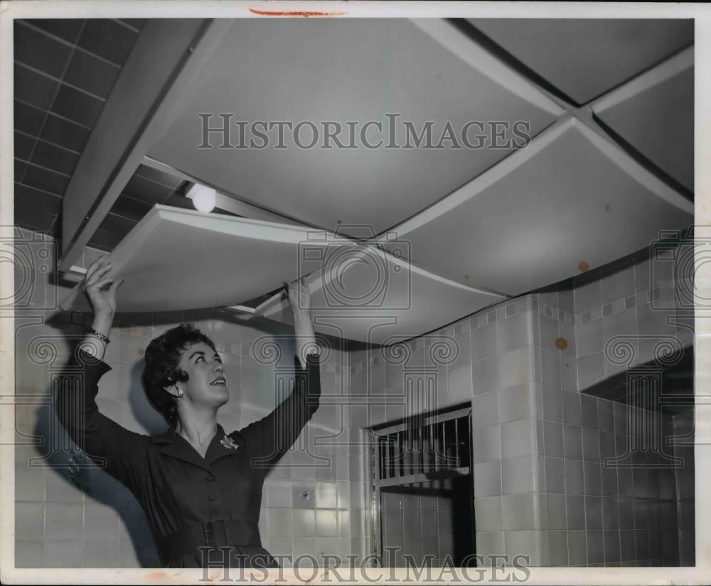 1958 Press Photo Louise Barber installing ceiling light diffuser - Historic Images