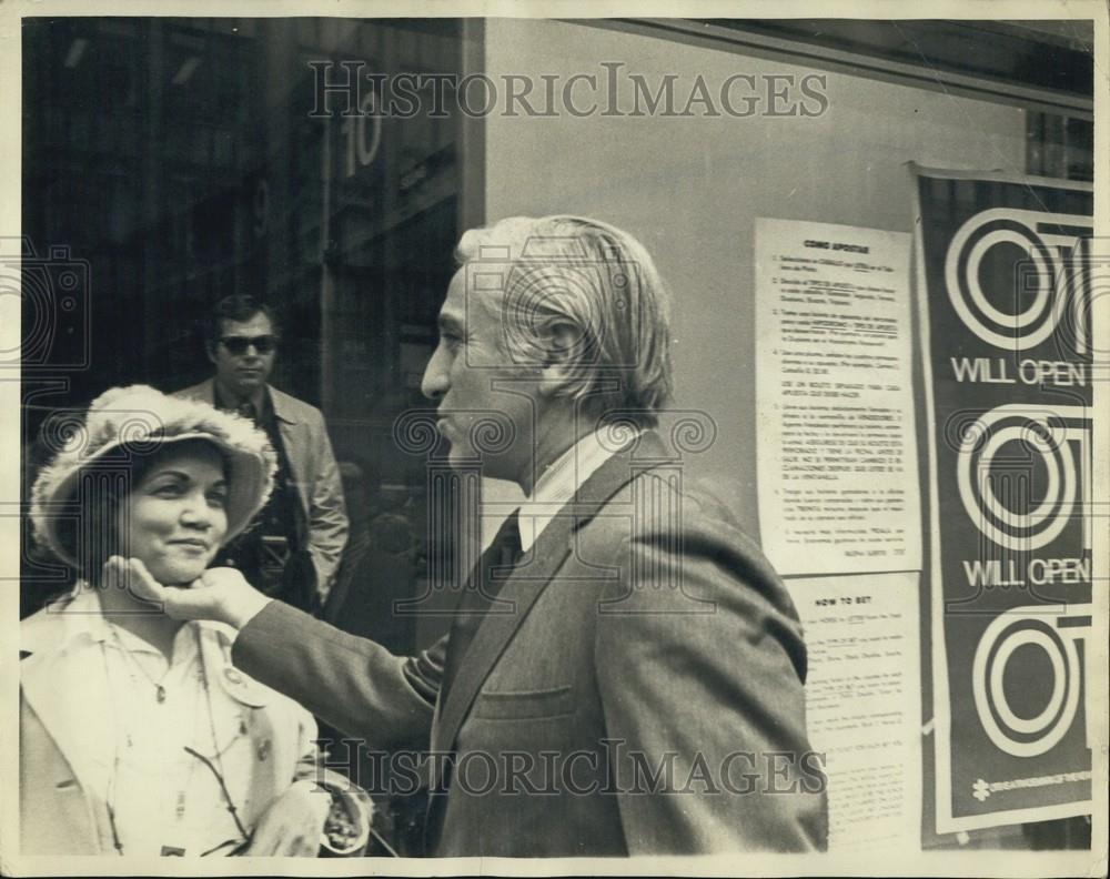 Press Photo older man holding young ladys face - Historic Images