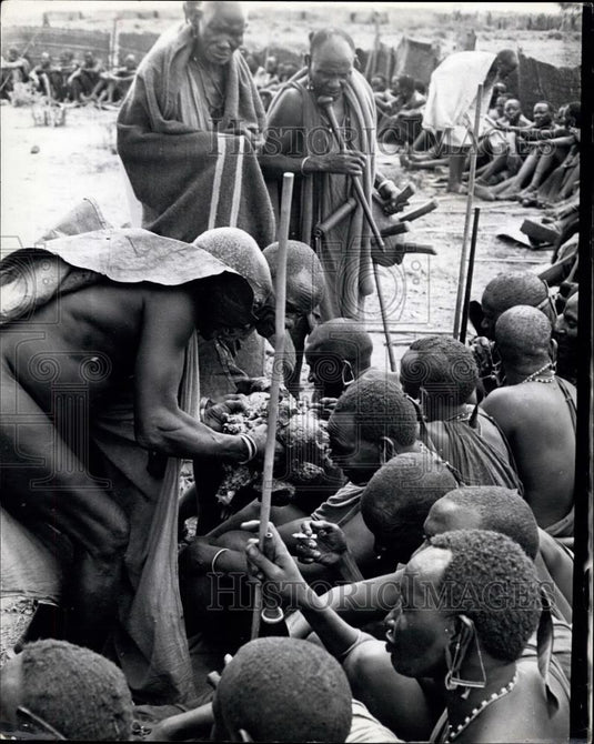 Press Photo Natives Serving Roasted Bull - Historic Images