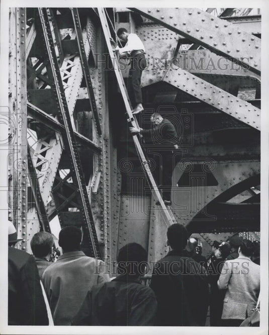 Press Photo Pedro Castro being rescued from a bridge - Historic Images