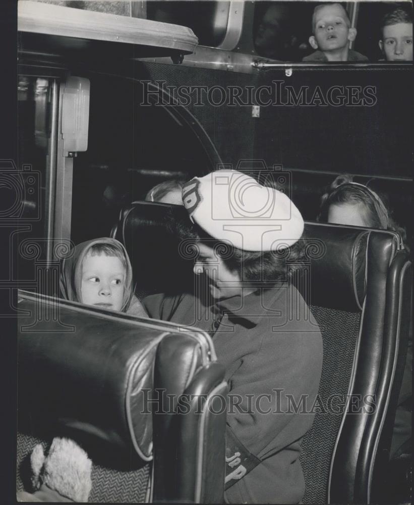 Press Photo Air Police look after toddler on bus - Historic Images