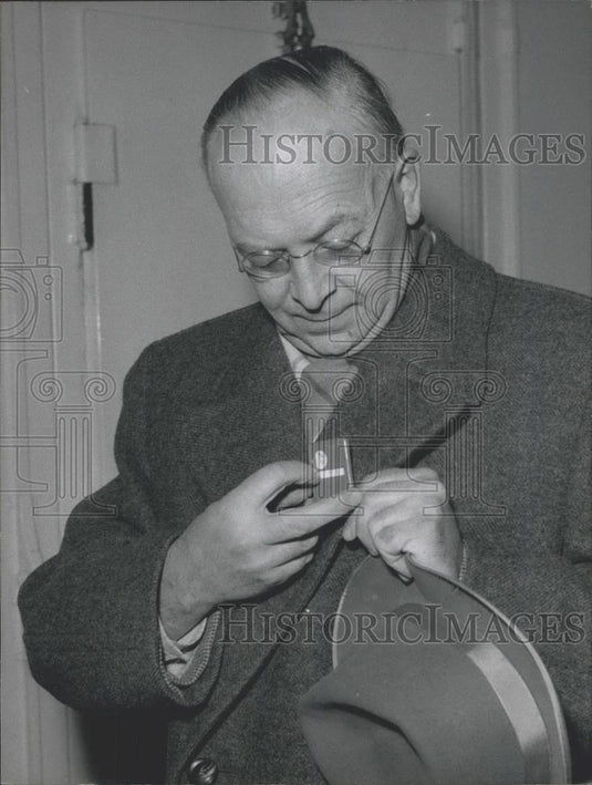Press Photo Man checks radiation badge?? - Historic Images