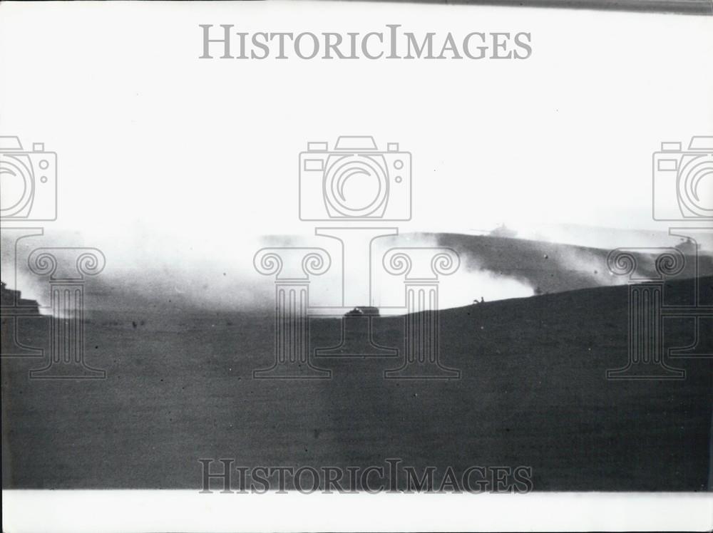 Press Photo Smoke Fills A Battle Ground As Tanks Move In The Background - Historic Images