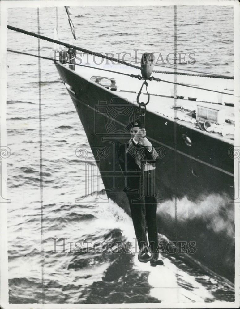 Press Photo A Man Hangs Over The Side Of A Ship - Historic Images