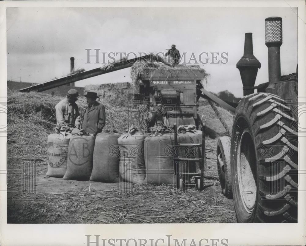 Press Photo A reporter talks to a French peasant during critical bread shortage - Historic Images